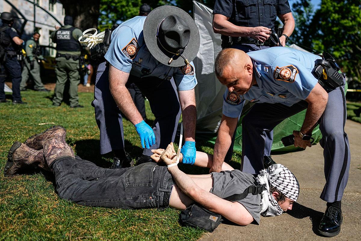 Georgia State Patrol detain a protester at a Pro-Palestinian protest at Emory University, April 25, 2024.