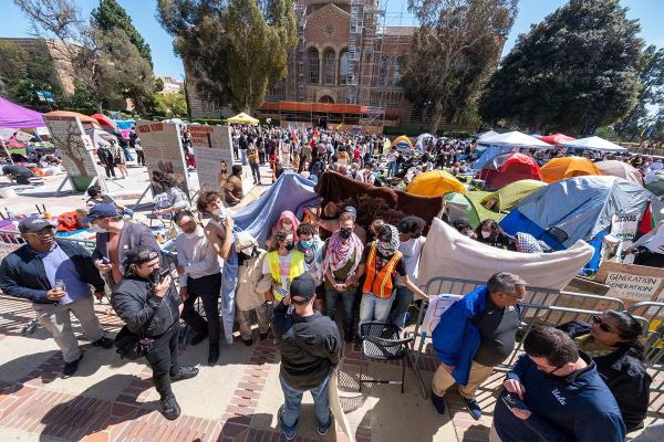Pro-Palestinian protesters block the media from entering an encampment at UCLA, April 26, 2024